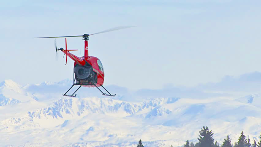 Flying helicopter in mountain weather